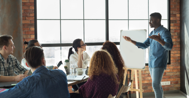 People having a meeting in a board room representing Identifying and Developing Your Next Generation of Leaders